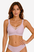 Pink seamless no-underwire bra with V-mesh yoke, front view