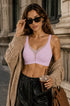 Pink wireless deep V mesh bra on model, seamless cups with no underwire