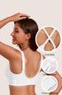 White full-coverage bra with cross-back straps and adjustable straps