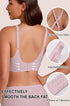 Pink seamless wireless bra with cross-back straps and adjustable band closure.