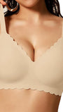 Light beige no-underwire full-coverage bra with scalloped edges and smooth cups.
